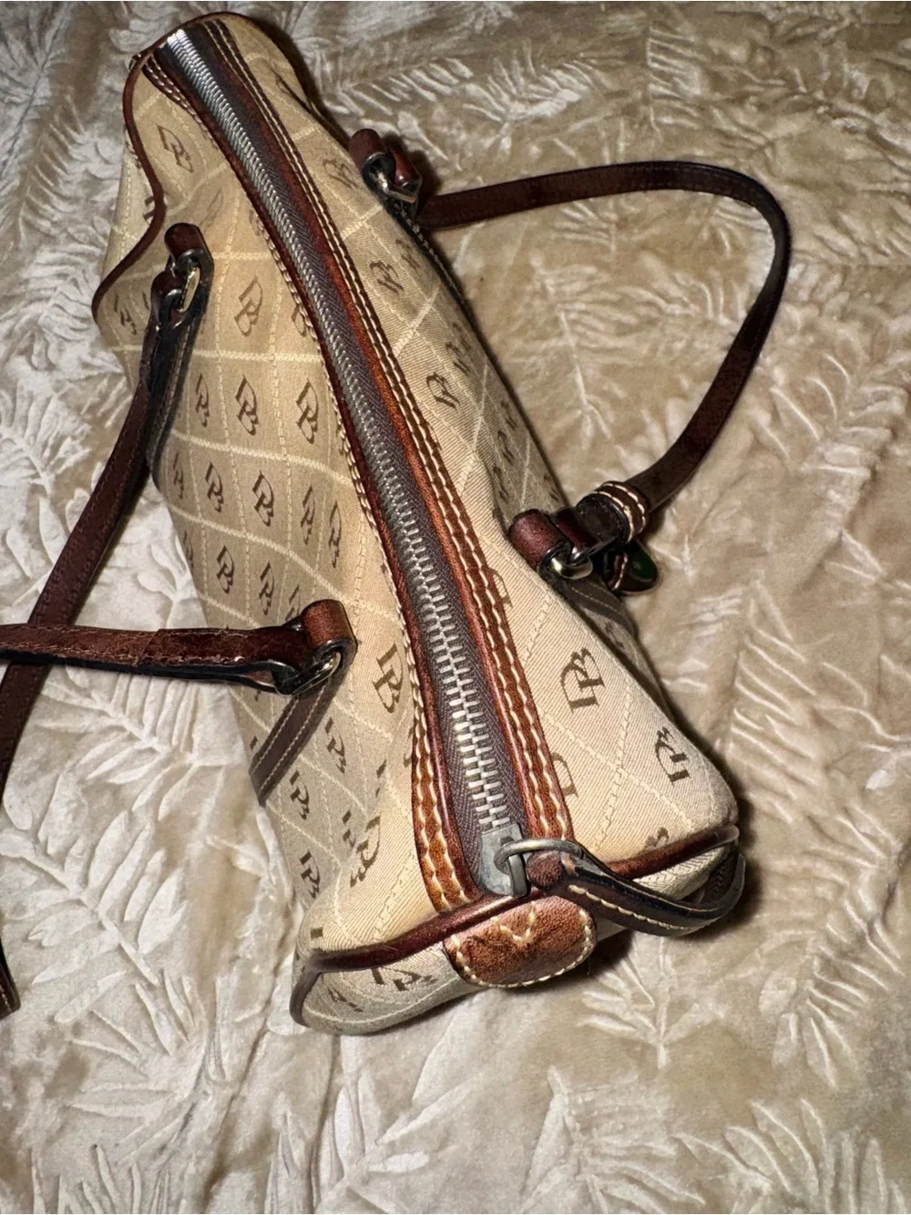 Dooney & Bourke Beige Logo Quilted Barrel Shoulder Bag with Brown Trim